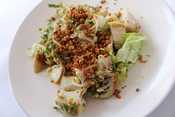 Indonesian traditional dish, kupat tahu, sticky rice with tofu.