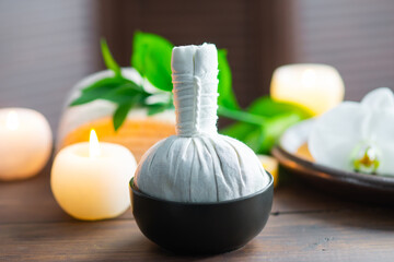 Spa background. Towel, candles, orchid flowers and herbal balls. Massage, oriental therapy, wellbeing and meditation.
