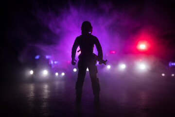 Anti-riot police give signal to be ready. Government power concept. Police in action. Smoke on a...