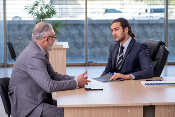 Two businessmen discussing business project