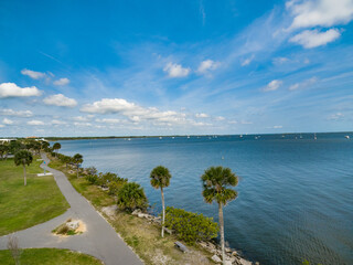 Indian River near the City of Titusville Florida on a beautiful morning with palm trees and clouds