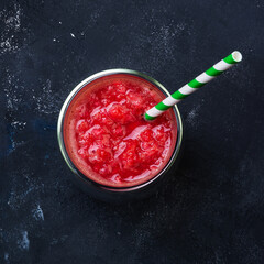 Red orange juice in a glass. Cocktail from Sicilian oranges. Creative minimal summer idea.