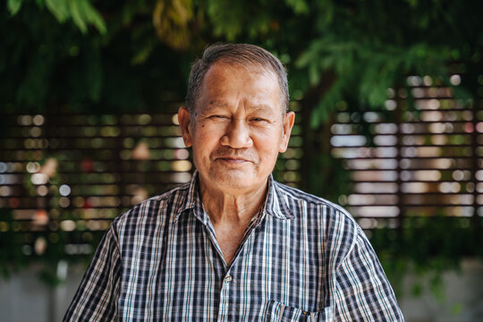 Close-up Portrait Of Smile Asian Senior Man Looking At Camera. Old Thai Man.