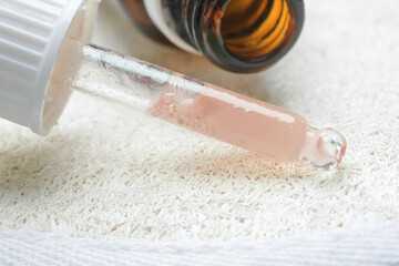 
Nourishing and hydrating facial serum in pipette, close up image