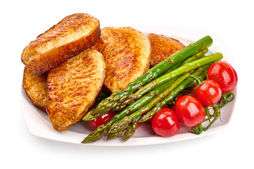 Grilled pork steaks with asparagus, isolated on white background. High resolution image