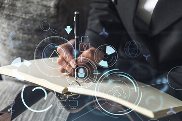 Businesswoman is writing down some ideas to create innovative software to change the world and...