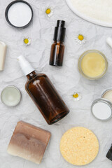 Natural, organic, plastic free skin care products, top view. Facial serums, essentials oils, creams and soap bars. 