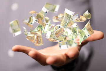 money euro banknote in hand rain