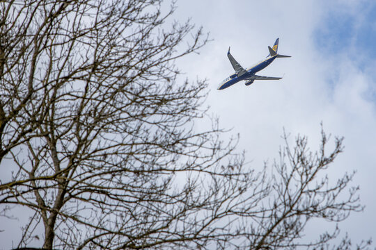 Overath, NRW, Germany, 03 28 2021, Ryanair plane on its way to Cologne airport. view from below. blue sky as background