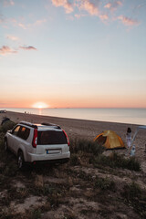 Fototapeta na wymiar view of camping summer vacation concept. sunrise above the sea
