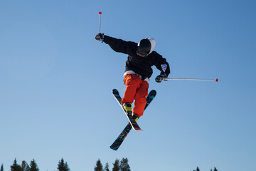 Fototapeta na wymiar Skier skiing on the slopes of the mountain. Winter sports.