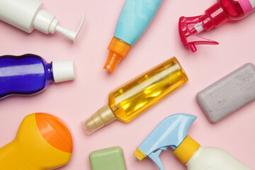 Colorful cosmetic products on bright pink background, top view