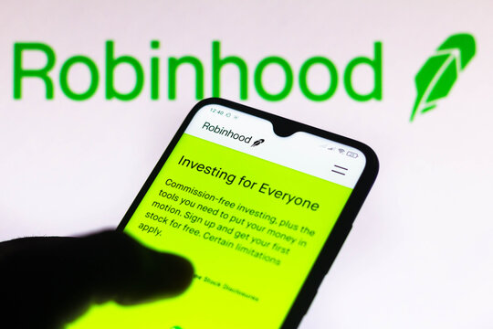 March 28, 2021, Brazil. In this photo illustration the Robinhood Markets logo is seen on a smartphone and a pc screen.