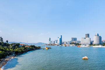 Sunny scenery of Gulangyu Island and city coastline in Xiamen, Fujian, China