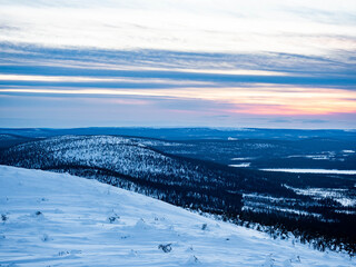 Winter scenery during sunset in snowy Lapland, Finland