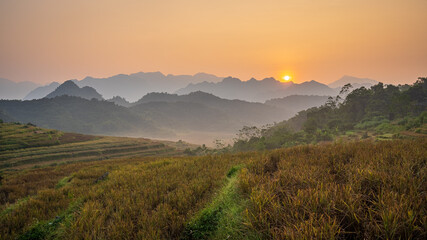 Fototapeta na wymiar Golden sunrise at Pu Luong village, a famous tourist attraction in Thanh Hoa, Vietnam