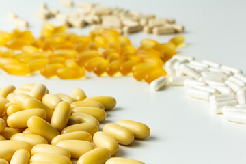 Pills on a light background. Top view. Medicine, treatment, illness. Medication in tablets. Flat lay. Copy space. Medicine concepts. 