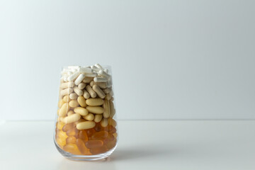 Pills on a light background. Top view. Medicine, treatment, illness. Medication in tablets. Flat lay. Copy space. Medicine concepts. 