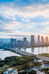 Fototapeta premium Early morning scenery of CBD city along the Minjiang River in Fuzhou, Fujian, China 