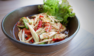 Super spicy papaya salad (Somtam) with fermented fish
