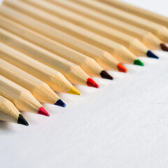 Obraz premium Kid Art education concept. Color pencils on white paper background. copy space