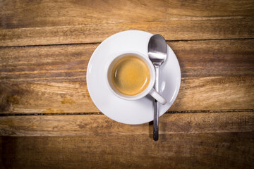 A Cup of Espresso or coffee on a wooden table - studio photography