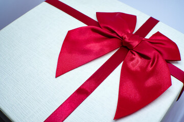Valentine present. Gift box and red ribbon for romantic couple.Gift box and ribbon with tag for valentine present