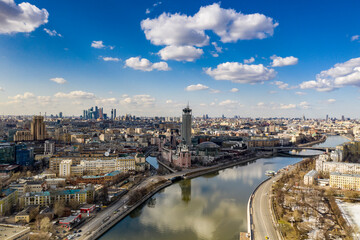 Fototapeta na wymiar panoramic view from drone on cityscape with river and bridges 