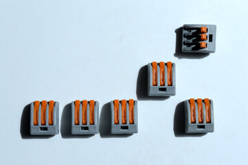 clamping terminal blocks lie on a light background. close-up.