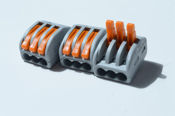clamping terminal blocks lie on a light background. close-up.