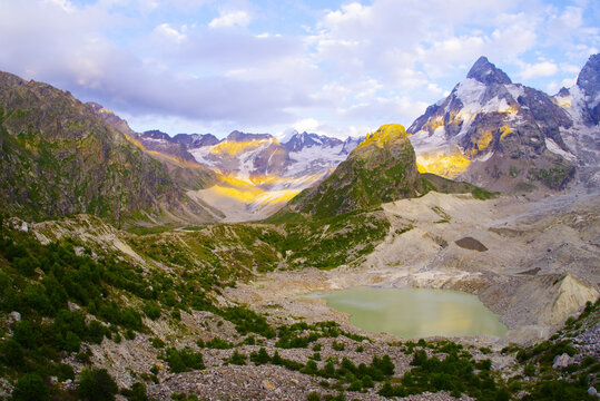 Lake Bashkara Upper on the background of the mountain ranges of the Caucasian Wall in the Elbrus region