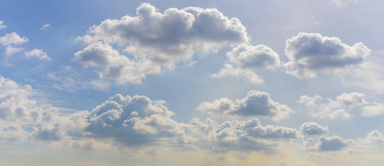 Panorama or panoramic photo of blue sky and white clouds or cloudscape.