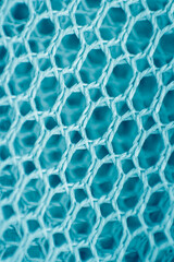 Blue mesh background. Mesh texture. Macro photo