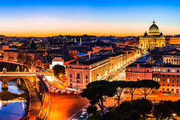 Fototapeta na wymiar Night view of St. Peter's Basilica and the Tiber river in Vatican City, Rome, Italy