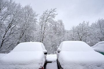 Snow-covered cars after heavy snow