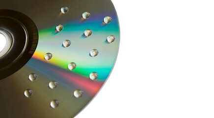 Water drops on CD disk isolated on white background. Macro