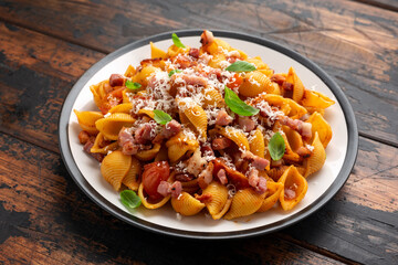 Conchiglie alla Amatriciana pasta with pancetta bacon, tomatoes and pecorino cheese. Healthy Italian food