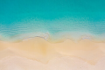 Fototapeta na wymiar Top view aerial photo from drone of stunning beautiful sea landscape beach with turquoise water with copy space for your text. Beautiful sand beach with turquoise water. Relax nature, amazing beach