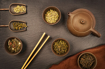 tea set flat lay on a dark background