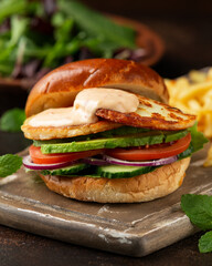 Halloumi cheese Burger with french fries. vegetarian food