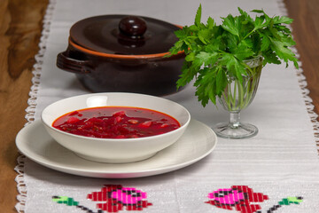 Plate with red soup. Soup with beets.