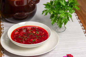 Plate with red soup. Soup with beets.