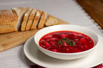 Plate with red soup. Soup with beets.