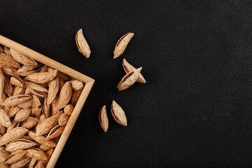 Dried wild almonds in their shells. Very tasty nuts. Prunus bucharica - species of wild almond...