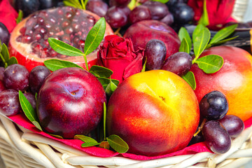 Juicy, fresh fruits, dark grapes and red apples, beautifully presented. Close-up