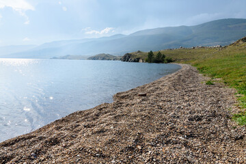 Pebble bay of Hadarta Cape in Small Sea strait, Lake Baikal