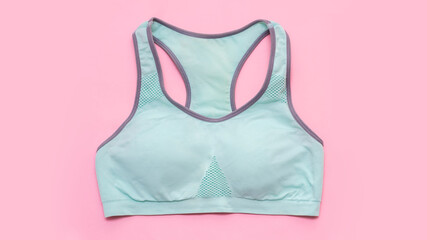 A turquoise sports short top isolated on pink background. Healthy lifestyle. Sport clothes