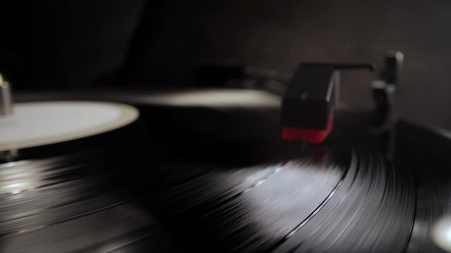 Record player in close-up - playing a vinyl - studio photography
