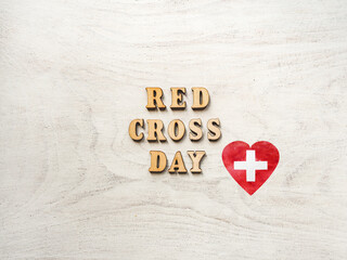 Red Cross Day. Beautiful greeting card. Close-up, view from above. National holiday concept. Congratulations for family, relatives, friends and colleagues