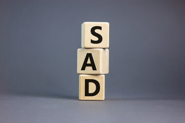 SAD, social anxiety disorder symbol. Concept words 'SAD, social anxiety disorder' on cubes on a beautiful grey background. Medical, psychological and SAD, social anxiety disorder concept. Copy space.